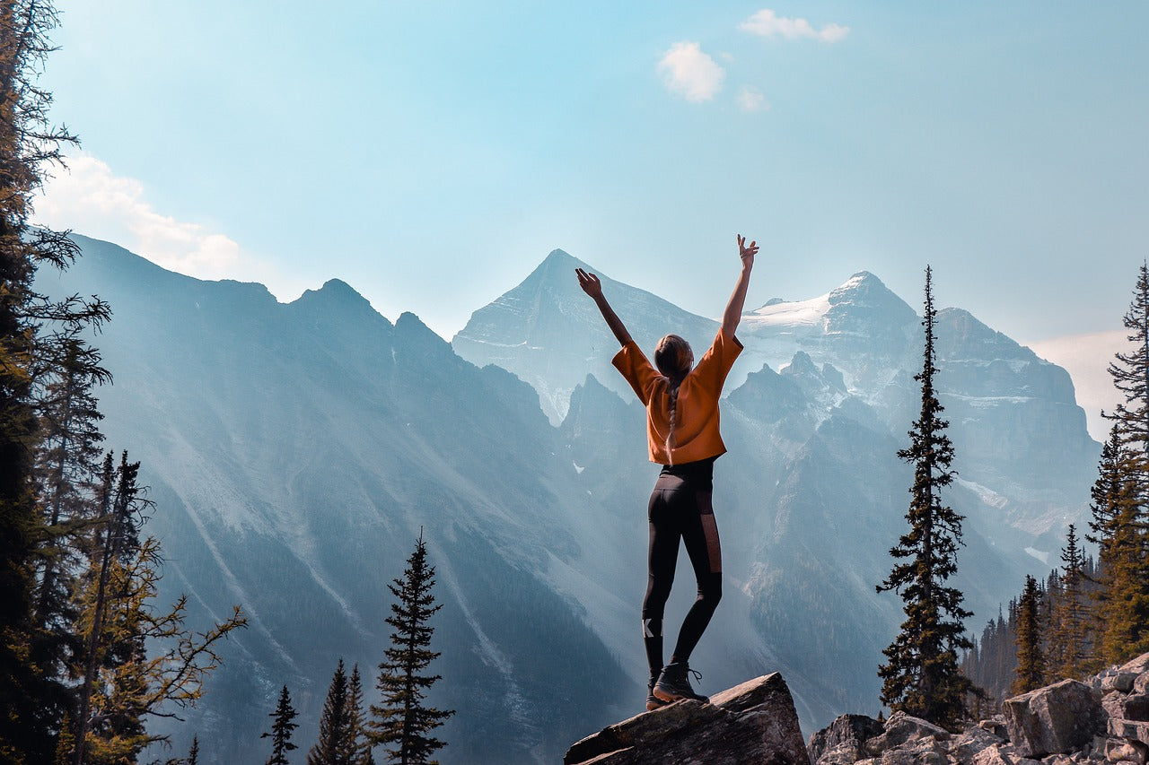 Person with mountainous backdrop